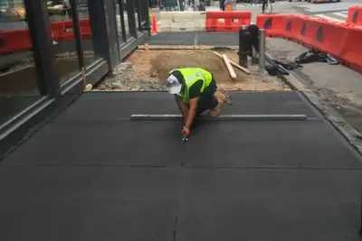Sidewalk finishing crew, sidewalk and curb work in New York